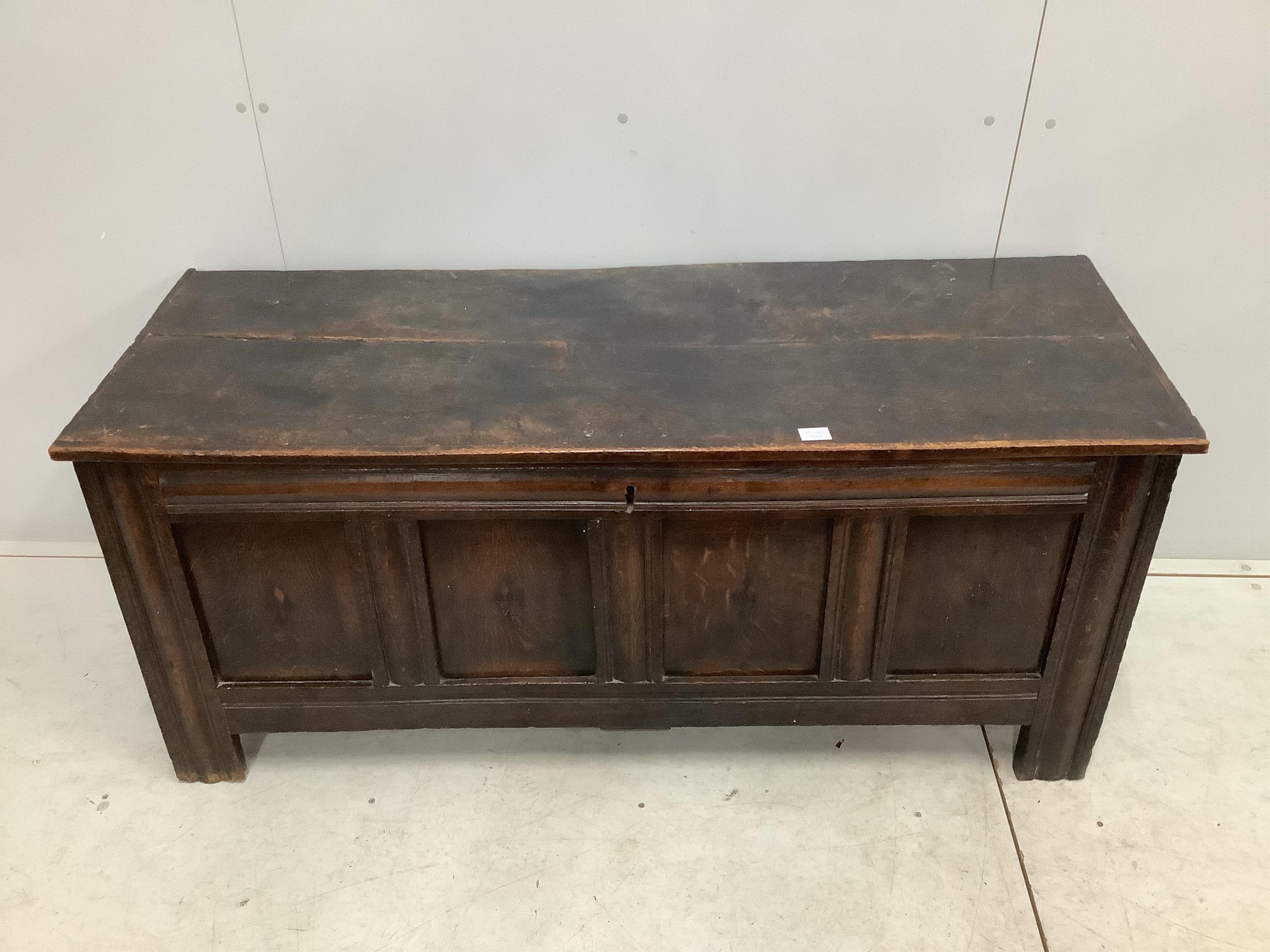 An early 18th century panelled oak coffer, width 151cm, depth 54cm, height 66cm. Condition - poor to fair